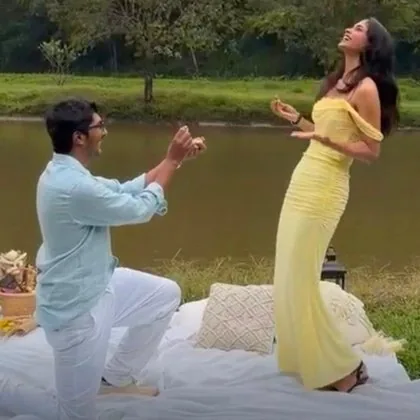 Ruthuparna on one knee, Anarghya laughing with joy